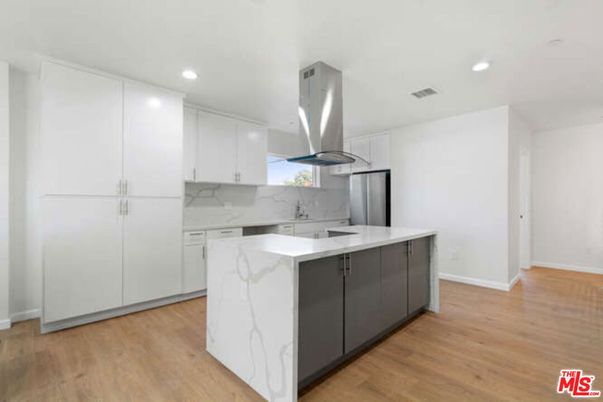 Interior, Kitchen, Marble Walls, Recessed Lighting, Stainless Steel Appliances, Wood Texture Flooring