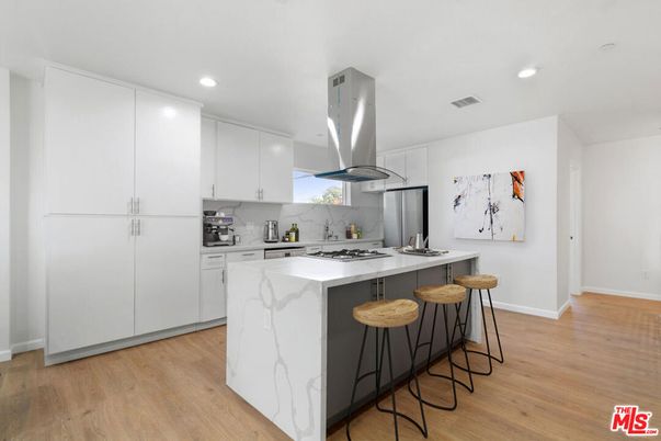 Interior, Kitchen, Marble Walls, Recessed Lighting, Stainless Steel Appliances, Wood Texture Flooring