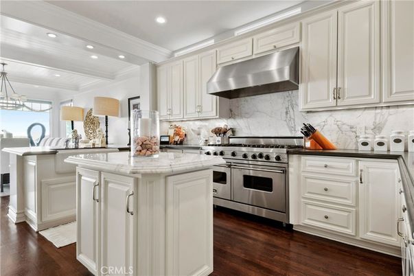 Interior, Kitchen, Marble Walls, Recessed Lighting, Stainless Steel Appliances, Wood Texture Flooring
