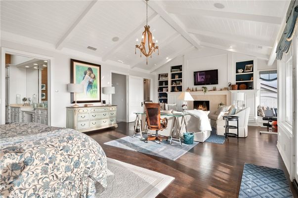 Bedroom, Chandelier, Fireplace, Interior, Living room, Pendant Lights, Recessed Lighting, Wood Texture Flooring