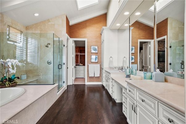 Bathroom, Dual Sink Vanities, Glass Shower, Interior, Recessed Lighting, Wood Texture Flooring