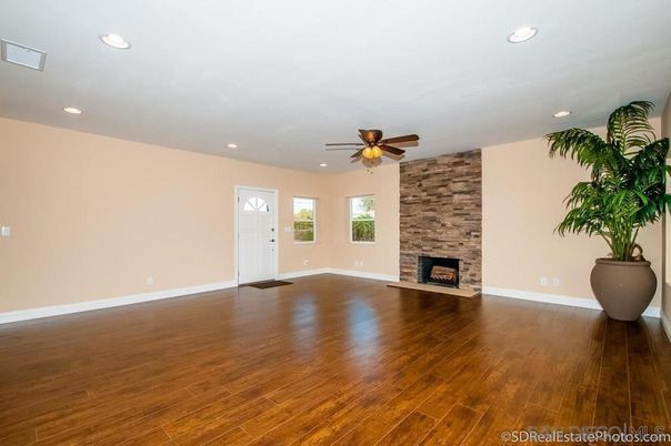 Empty room, Fireplace, Interior, Recessed Lighting, Stone Walls, Wood Texture Flooring