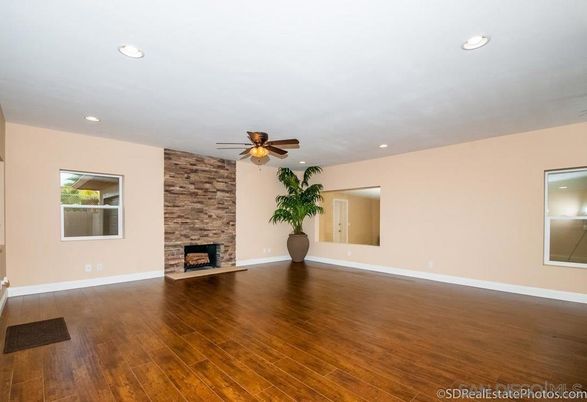 Empty room, Fireplace, Interior, Recessed Lighting, Stone Walls, Wood Texture Flooring