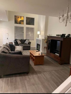 Chandelier, Fireplace, Interior, Living room, Recessed Lighting, Wood Texture Flooring