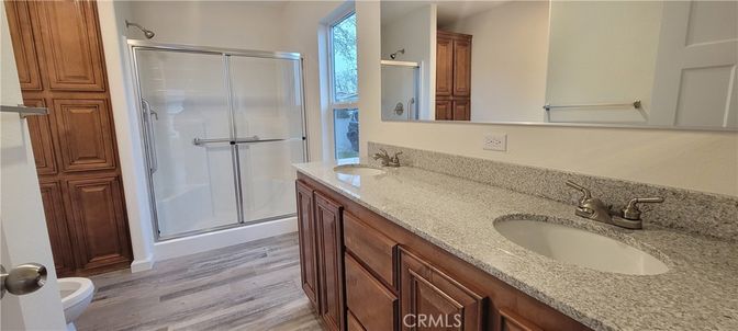 Bathroom, Dual Sink Vanities, Glass Shower, Interior, Wood Texture Flooring