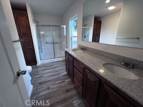 Bathroom, Dual Sink Vanities, Glass Shower, Interior, Recessed Lighting, Wood Texture Flooring