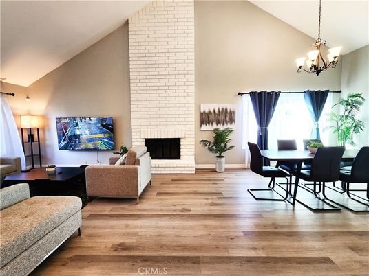 Chandelier, Dining room, Fireplace, Interior, Living room, Stone Walls, Wood Texture Flooring