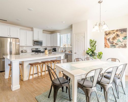 Chandelier, Dining room, Interior, Kitchen, Pendant Lights, Recessed Lighting, Stainless Steel Appliances, Wood Texture Flooring