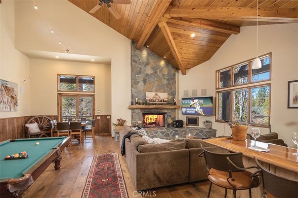 Billiard Table, Dining room, Fireplace, Game Room, Interior, Living room, Pendant Lights, Recessed Lighting, Stone Walls, Wooden Beams, Wooden Ceilings, Wood Texture Flooring