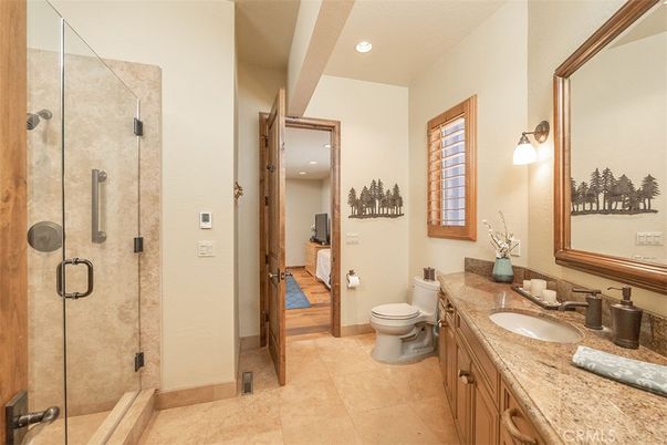 Bathroom, Dual Sink Vanities, Glass Shower, Interior, Recessed Lighting, Wood Texture Flooring