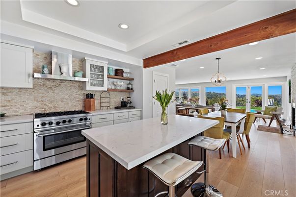 Chandelier, Dining room, Interior, Kitchen, Pendant Lights, Recessed Lighting, Stainless Steel Appliances, Water, Wooden Beams, Wood Texture Flooring