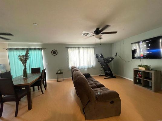 Dining room, Fitness Equipment, Interior, Living room, Recessed Lighting, Wood Texture Flooring