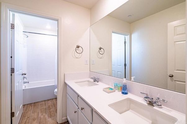 Bathroom, Dual Sink Vanities, Interior, Recessed Lighting, Wood Texture Flooring