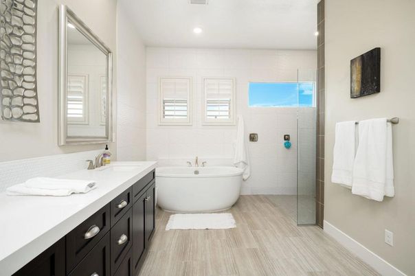 Bathroom, Dual Sink Vanities, Free Standing Baths, Glass Shower, Interior, Recessed Lighting, Wood Texture Flooring