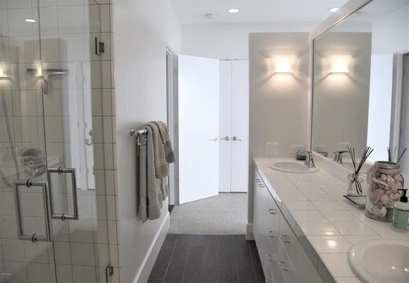 Bathroom, Dual Sink Vanities, Glass Shower, Interior, Recessed Lighting, Tile Countertops, Wood Texture Flooring