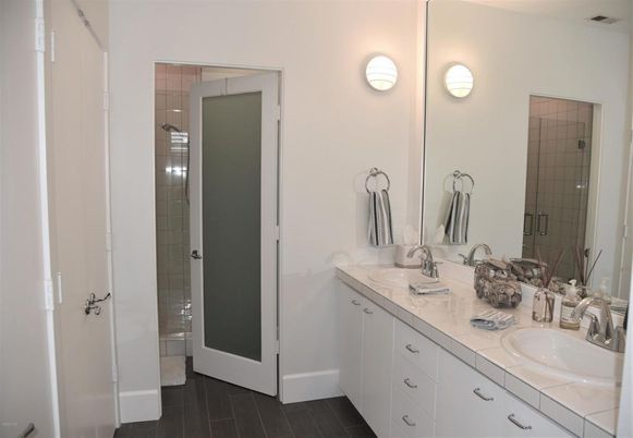Bathroom, Dual Sink Vanities, Glass Shower, Interior, Tile Countertops, Wood Texture Flooring