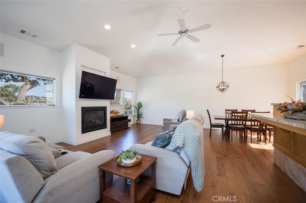 Dining room, Fireplace, Interior, Living room, Pendant Lights, Recessed Lighting, Wood Texture Flooring