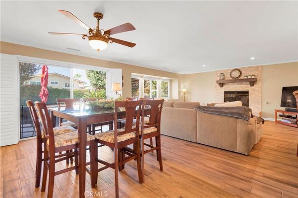 Dining room, Fireplace, Interior, Living room, Recessed Lighting, Stone Walls, Wood Texture Flooring