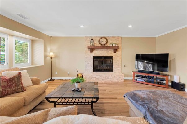Fireplace, Interior, Living room, Recessed Lighting, Stone Walls, Wood Texture Flooring