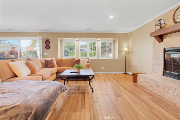 Fireplace, Interior, Living room, Recessed Lighting, Stone Walls, Wood Texture Flooring