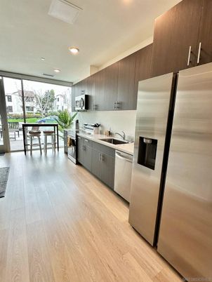 Dining room, Interior, Kitchen, Recessed Lighting, Stainless Steel Appliances, Wood Texture Flooring