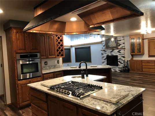 Fireplace, Interior, Kitchen, Recessed Lighting, Stainless Steel Appliances, Stone Walls, Wooden Ceilings, Wood Texture Flooring