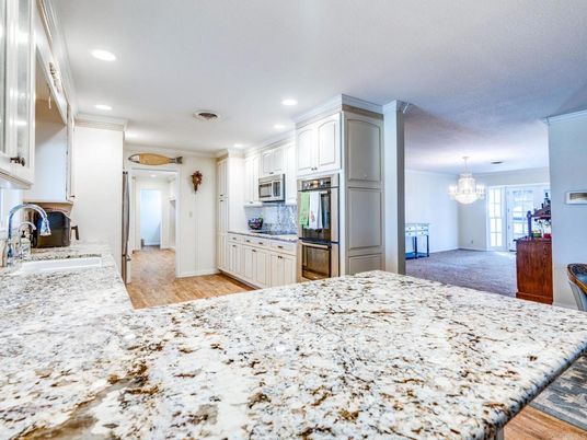 Chandelier, Fireplace, Interior, Kitchen, Recessed Lighting, Stainless Steel Appliances, Wood Texture Flooring