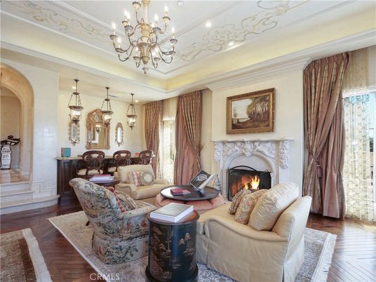 Chandelier, Dining room, Fireplace, Interior, Living room, Pendant Lights, Recessed Lighting, Wood Texture Flooring