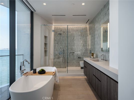 Bathroom, Dual Sink Vanities, Free Standing Baths, Glass Shower, Interior, Recessed Lighting, Water, Wood Texture Flooring