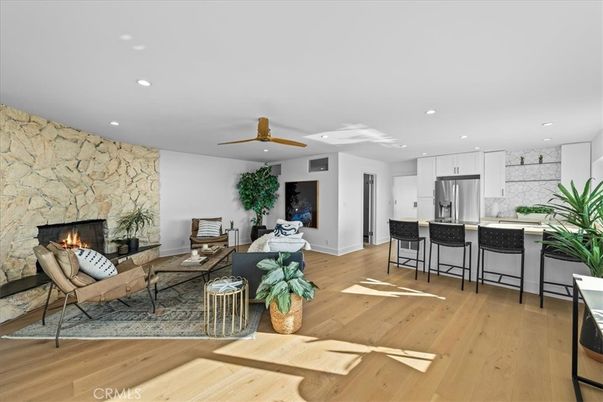 Fireplace, Interior, Kitchen, Living room, Recessed Lighting, Stainless Steel Appliances, Stone Walls, Wood Texture Flooring