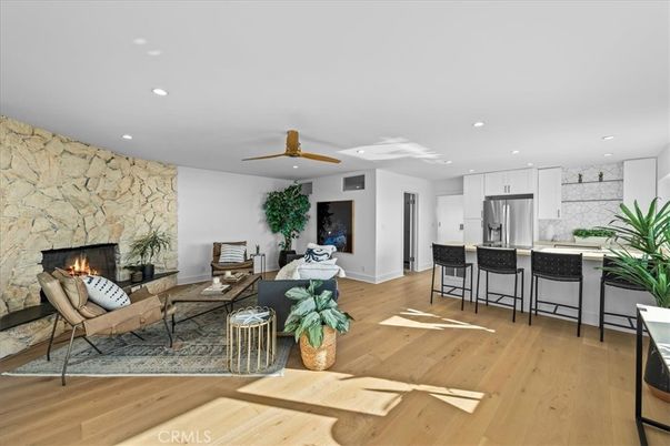 Fireplace, Interior, Kitchen, Living room, Recessed Lighting, Stainless Steel Appliances, Stone Walls, Wood Texture Flooring
