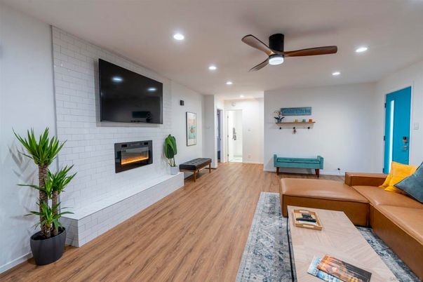 Fireplace, Interior, Living room, Recessed Lighting, Stone Walls, Wood Texture Flooring