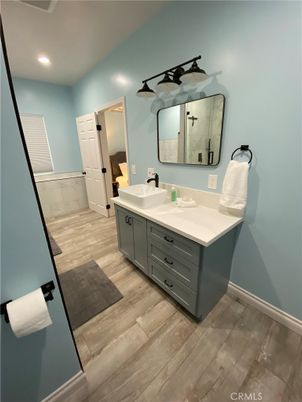 Bathroom, Dual Sink Vanities, Interior, Recessed Lighting, Wood Texture Flooring