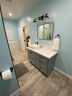 Bathroom, Dual Sink Vanities, Interior, Recessed Lighting, Wood Texture Flooring