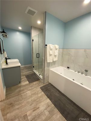 Bathroom, Glass Shower, Interior, Marble Walls, Recessed Lighting, Wood Texture Flooring