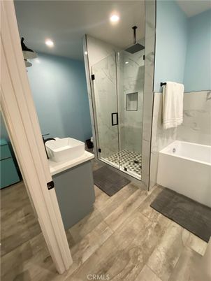 Bathroom, Glass Shower, Interior, Marble Walls, Recessed Lighting, Wood Texture Flooring