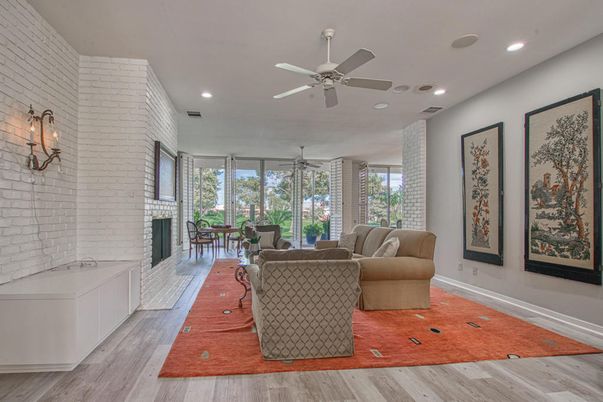 Dining room, Fireplace, Interior, Living room, Recessed Lighting, Stone Walls, Wood Texture Flooring