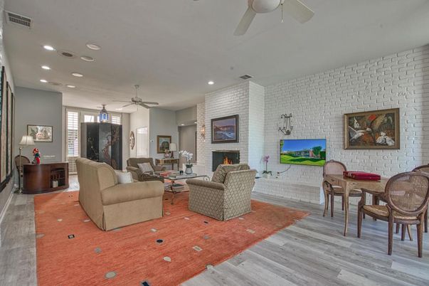 Dining room, Fireplace, Interior, Living room, Recessed Lighting, Stone Walls, Wood Texture Flooring