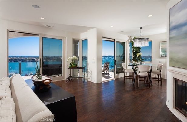 Chandelier, Dining room, Fireplace, Interior, Pendant Lights, Recessed Lighting, Water, Wood Texture Flooring