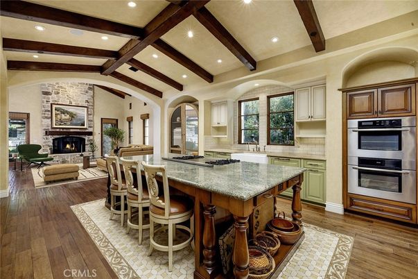 Fireplace, Interior, Kitchen, Living room, Recessed Lighting, Stainless Steel Appliances, Stone Walls, Wooden Beams, Wood Texture Flooring