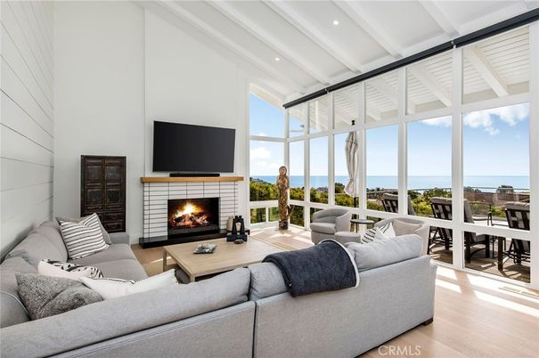 Dining room, Fireplace, Interior, Living room, Recessed Lighting, Water, Wood Texture Flooring