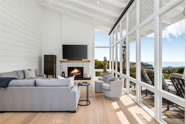 Fireplace, Interior, Living room, Recessed Lighting, Water, Wood Texture Flooring