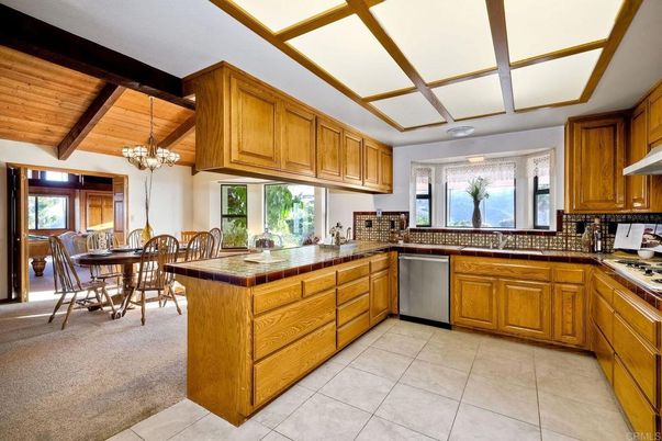 Chandelier, Dining room, Interior, Kitchen, Tile Countertops, Wooden Beams, Wooden Ceilings