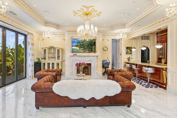 Chandelier, Fireplace, Interior, Living room, Marble, Recessed Lighting