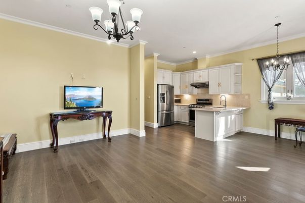 Chandelier, Interior, Kitchen, Pendant Lights, Recessed Lighting, Stainless Steel Appliances, Wood Texture Flooring