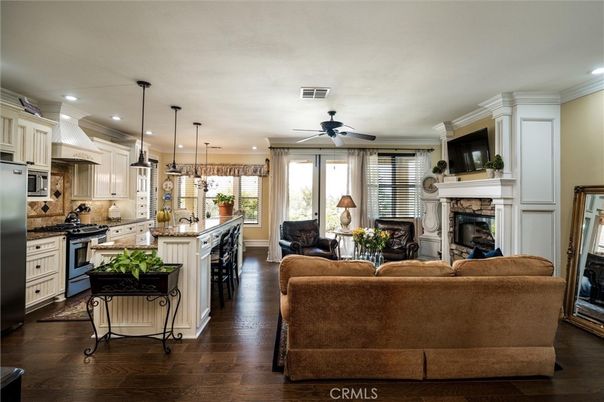 Fireplace, Interior, Kitchen, Living room, Pendant Lights, Recessed Lighting, Stainless Steel Appliances, Wood Texture Flooring