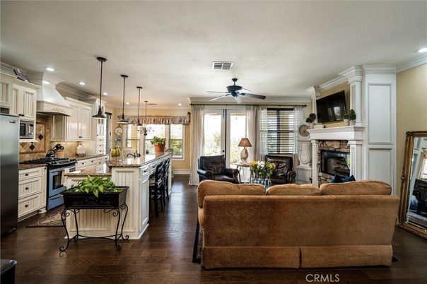 Fireplace, Interior, Kitchen, Living room, Pendant Lights, Recessed Lighting, Stainless Steel Appliances, Wood Texture Flooring