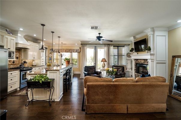 Fireplace, Interior, Kitchen, Living room, Pendant Lights, Recessed Lighting, Stainless Steel Appliances, Wood Texture Flooring