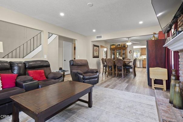 Dining room, Fireplace, Interior, Kitchen, Living room, Recessed Lighting, Wood Texture Flooring