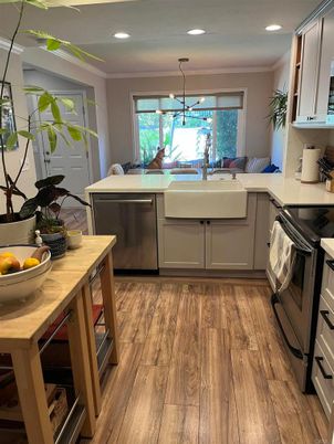 Dining room, Interior, Kitchen, Pendant Lights, Recessed Lighting, Stainless Steel Appliances, Wood Texture Flooring